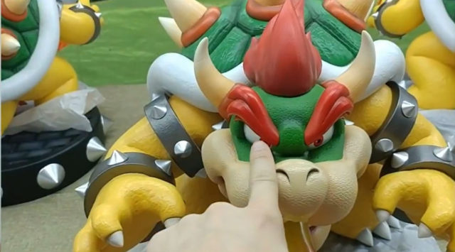 Alex Pokes Bowser F4F Statue in the Eye